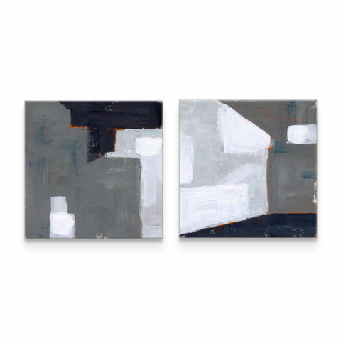 two paintings of white and black on a white wall