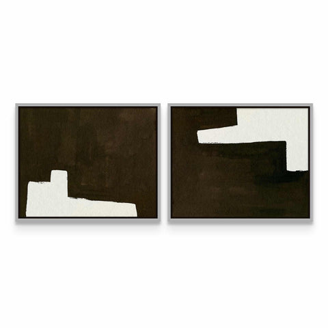 two black and white paintings on a white wall