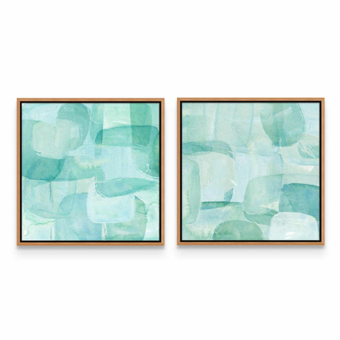 two framed paintings of blue and green shapes