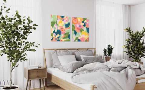 a bedroom with a bed and a painting on the wall
