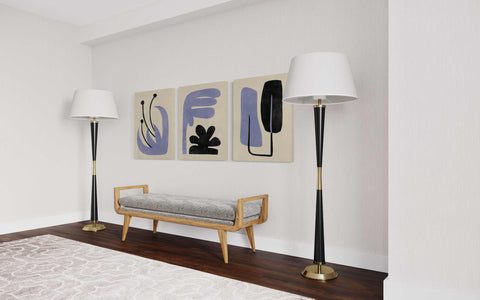 a living room with two lamps and a bench