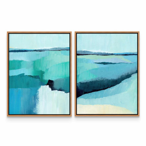 two paintings of blue and green water on a white wall