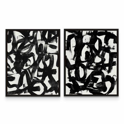 two black and white paintings on a white wall