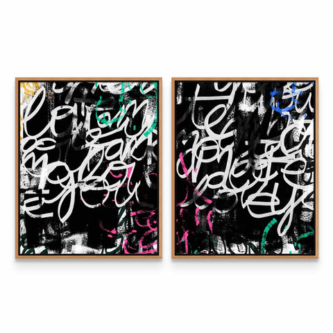 a couple of framed paintings on a wall