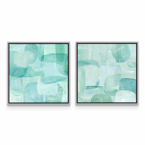 two abstract paintings on a white wall