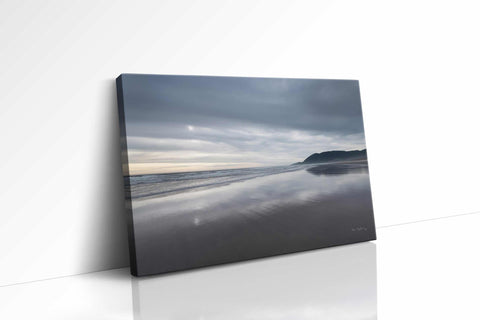 a picture of a beach on a cloudy day