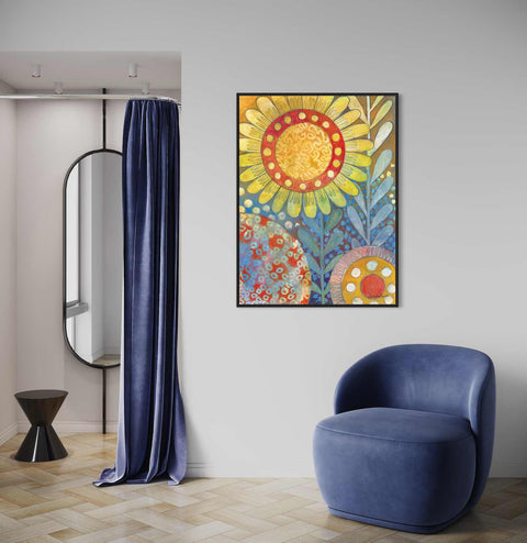 a blue chair sitting in front of a painting on a wall