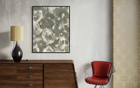 a red chair sitting on top of a wooden dresser