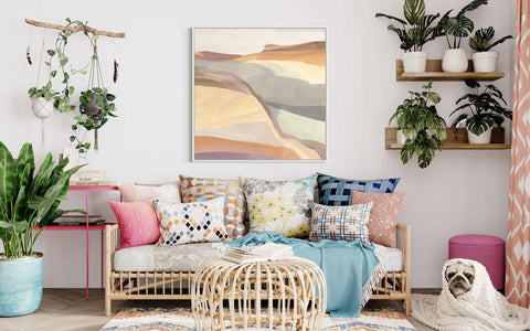 a living room filled with lots of furniture and plants
