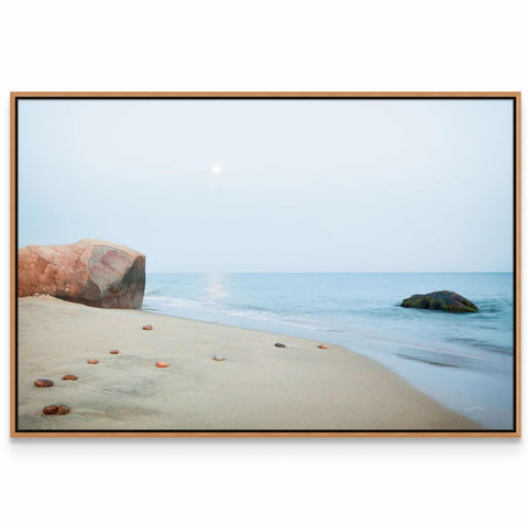 a picture of a beach with rocks and water