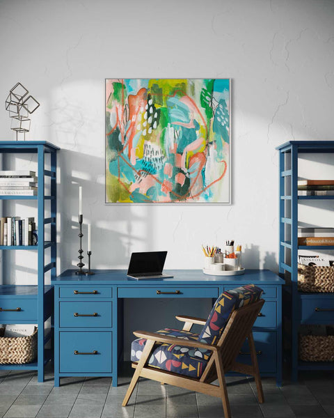 a blue desk with a laptop on top of it