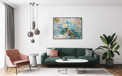 a living room filled with furniture and a painting on the wall