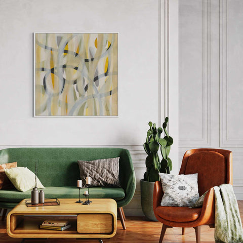 a living room filled with furniture and a painting on the wall