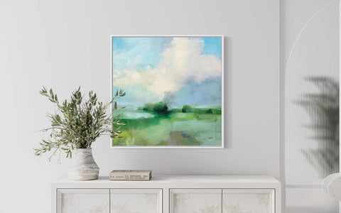 a painting hanging on a wall above a dresser
