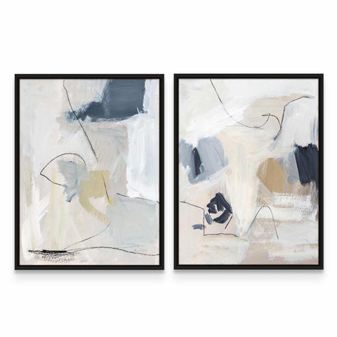 two framed paintings of abstract art on a wall
