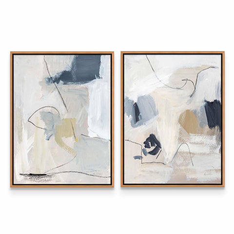 two abstract paintings on a white wall