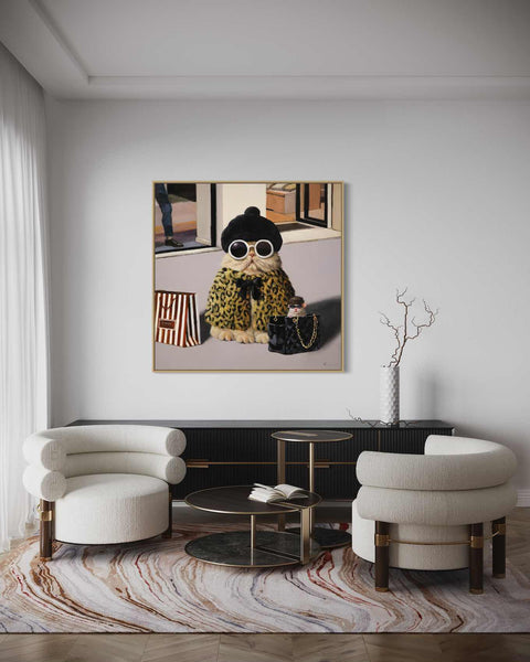 a living room with two chairs and a painting on the wall