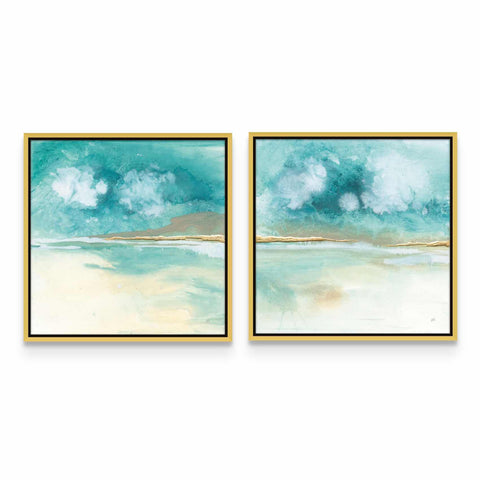 two paintings of blue and white clouds hanging on a wall