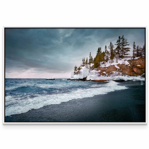 a picture of a beach with trees on the shore