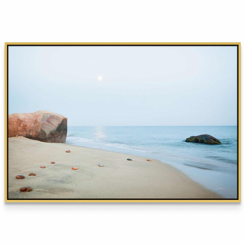 a picture of a beach with rocks and water