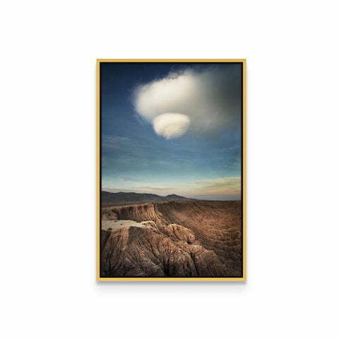 a picture of a mountain range with a cloud in the sky