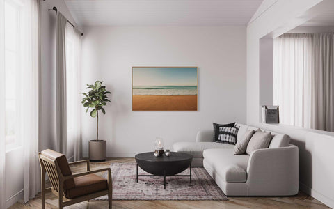 a living room filled with furniture and a painting on the wall