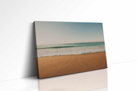 a picture of a beach with waves coming in