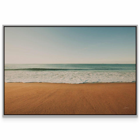 a picture of a beach with the ocean in the background