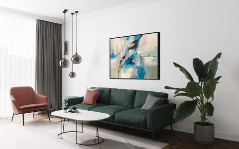 a living room filled with furniture and a painting on the wall