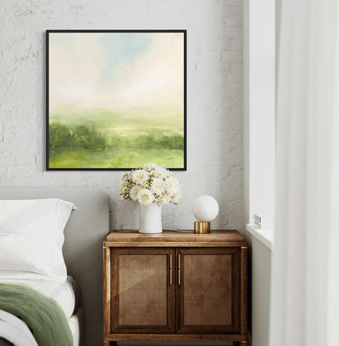 a bedroom with a bed and a painting on the wall