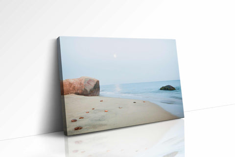 a picture of a beach with rocks and water