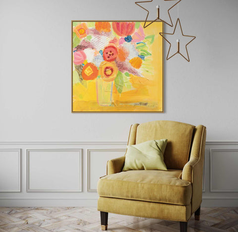 a chair in a room with a painting on the wall