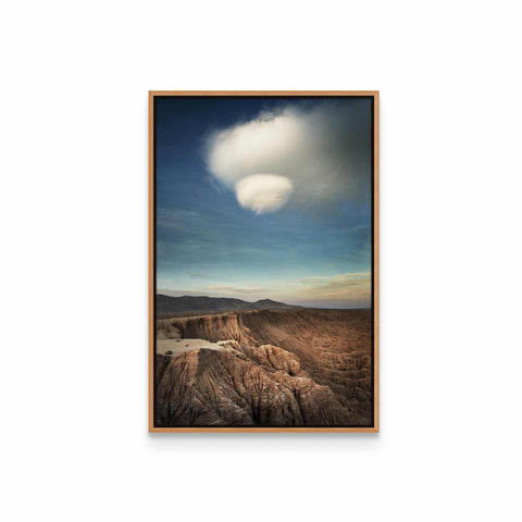 a picture of a mountain range with a cloud in the sky