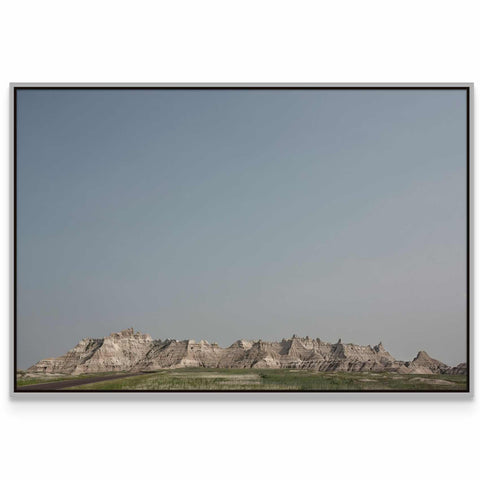 a picture of a mountain range with a sky background
