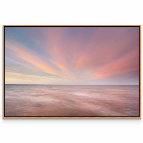 a picture of a sunset over the ocean