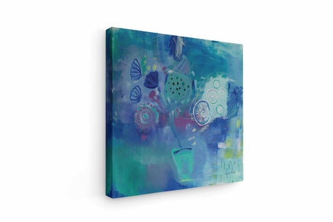 a painting on a white wall with blue and green colors