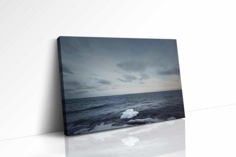 a picture of the ocean on a white wall