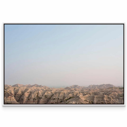 a picture of a mountain range with a sky background
