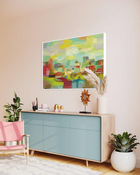 a living room with a painting on the wall