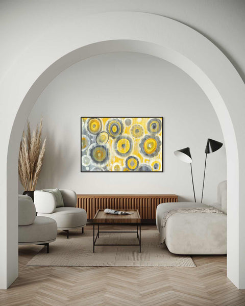 a living room with a couch a chair and a painting on the wall