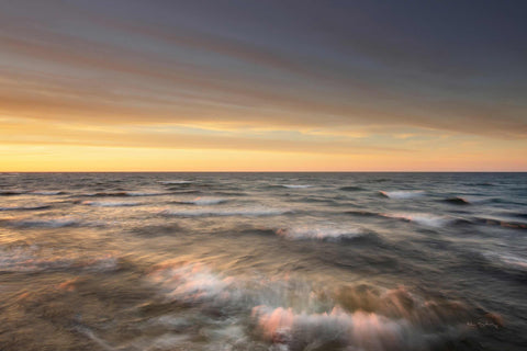 a view of a body of water at sunset