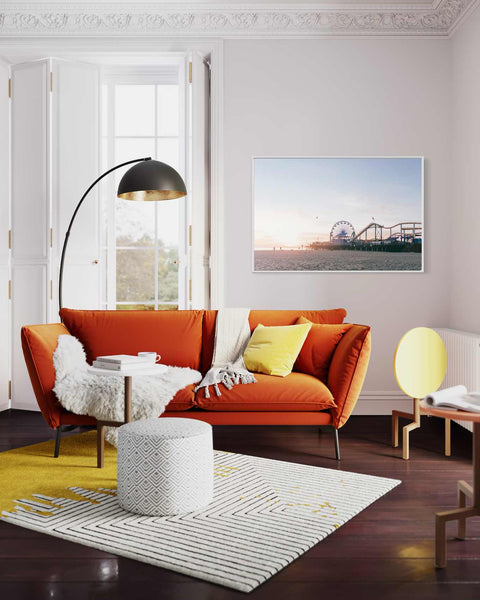 a living room filled with furniture and a large window