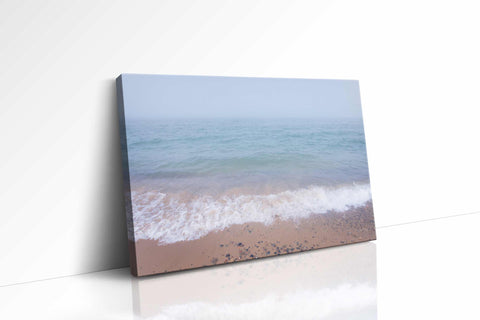 a picture of a beach with waves coming in