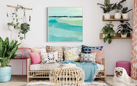 a living room filled with lots of furniture and plants