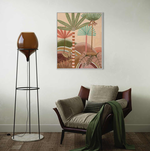 a living room with a chair and a lamp