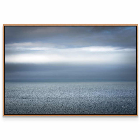a picture of a large body of water under a cloudy sky